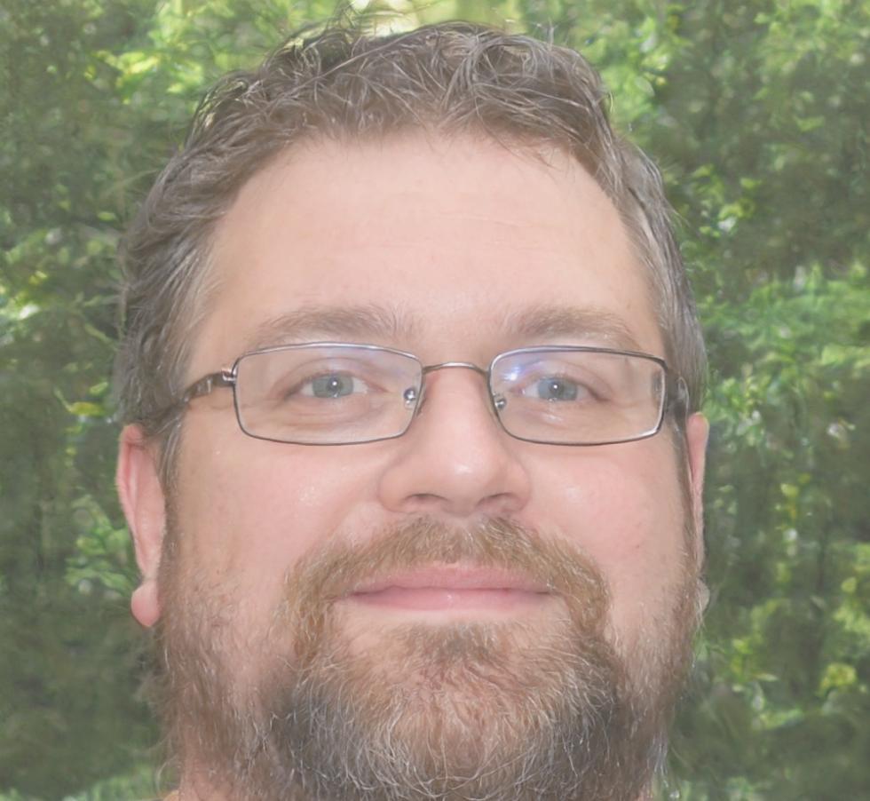 Professional financial instructor reviewing course materials